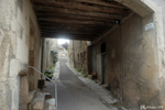 A street passing under the houses