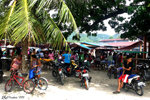 Anda - Motorbike taxis wait for customers at the exit of the market