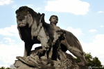 A lion, a child, who is protecting whom? Paris